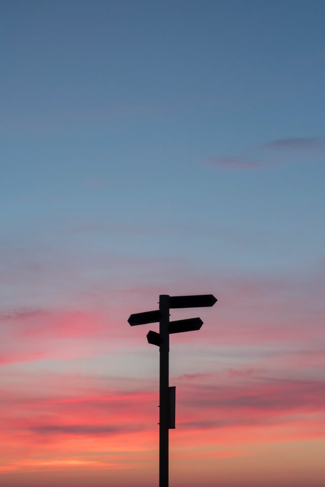 sign post in sunset depicting future direction